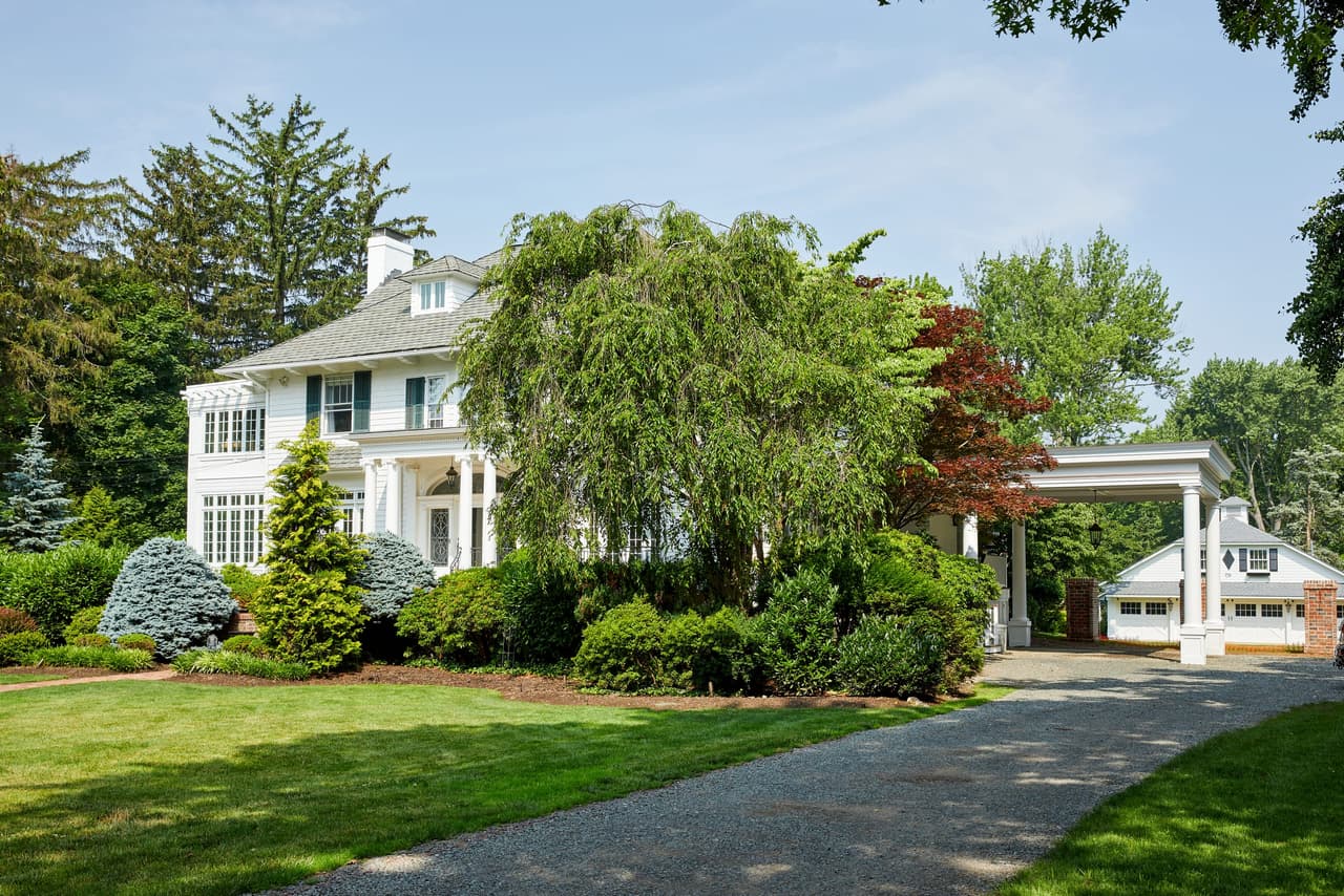 Exterior of a classic white historic Westfield, NJ home with carport